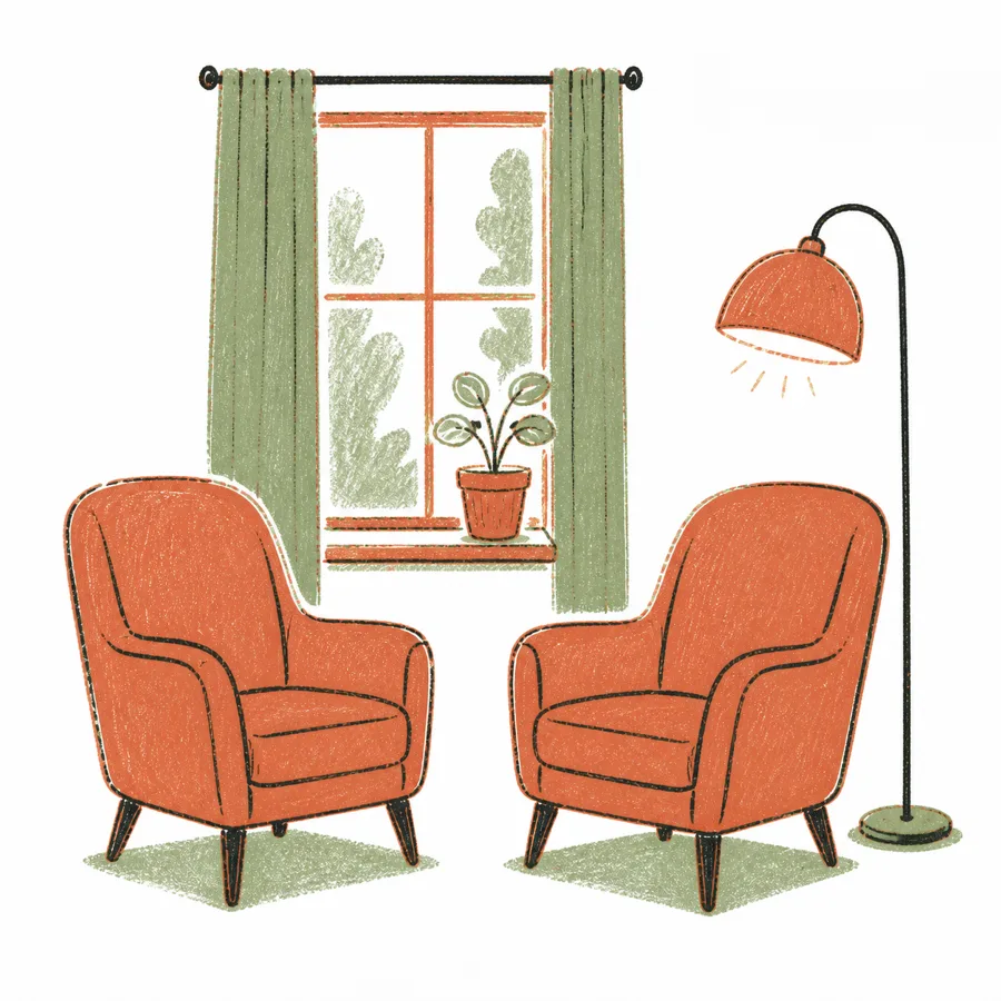 Two chairs facing each other by a window
